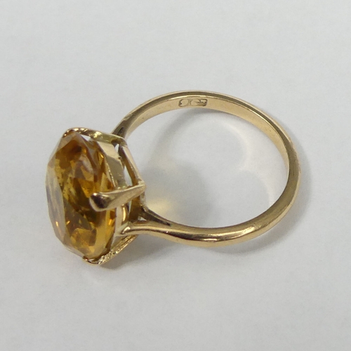 20 - 9 carat gold Citrine single stone ring, 3.3 grams. Size L, 14 mm wide. UK Postage £12.