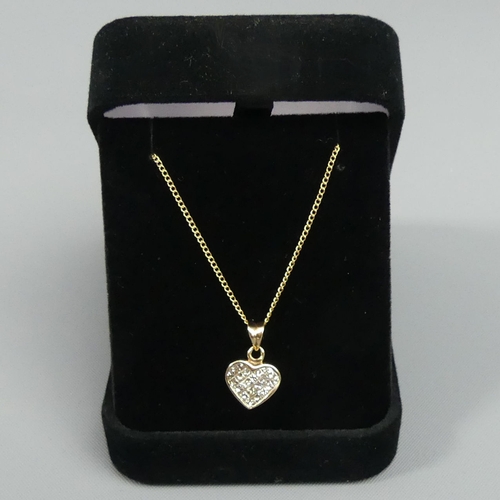 22 - 9 carat gold Diamond pendant and chain, 2.3 grams. Pendant 17 x 10 mm, chain 50 cm. UK Postage £12.