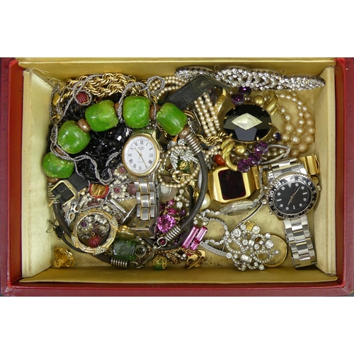 6a - A leather box of mixed jewellery and watches, including stone set brooches. UK Postage £15.