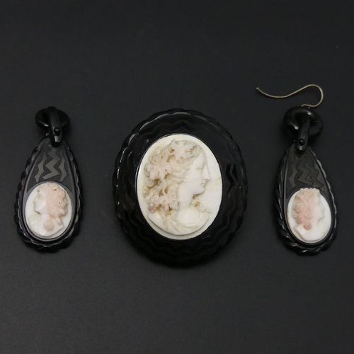 40 - Victorian French Jet and carved Coral cameo brooch and earrings. Brooch 45 x 39 mm. UK Postage £12.