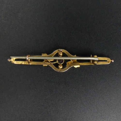 41 - 9 carat gold bar brooch stone set with Suffragette colours, 2.1 grams. 48 mm long. UK Postage £12.