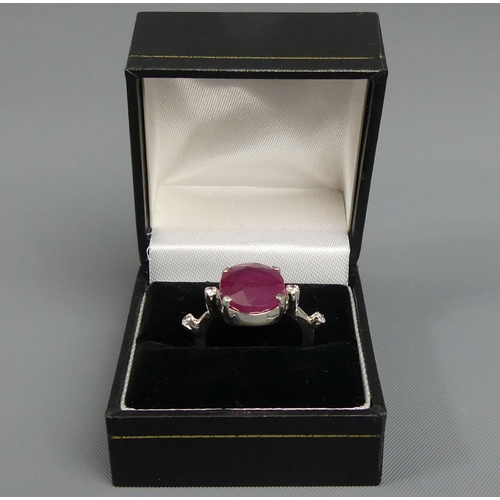 47 - Sterling silver 10 carat ruby dress ring, size O 1/2, top 14 mm, 1.7 mm band. 5 grams. UK Postage £1... 