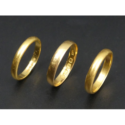 51 - Three 22 carat gold wedding rings, various dates and sizes. 8.3 grams. Various dates and sizes. UK P... 