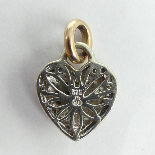 13 - 9 carat white and yellow gold diamond set heart pendant, 2.9 grams. 14 x 20 mm. UK Postage £12.