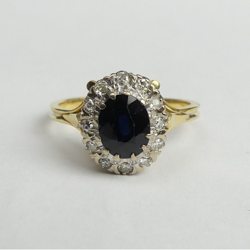 17 - 18 carat gold sapphire and diamond ring, 4.2 grams. Size R, 12.7 mm wide. UK Postage £12.
