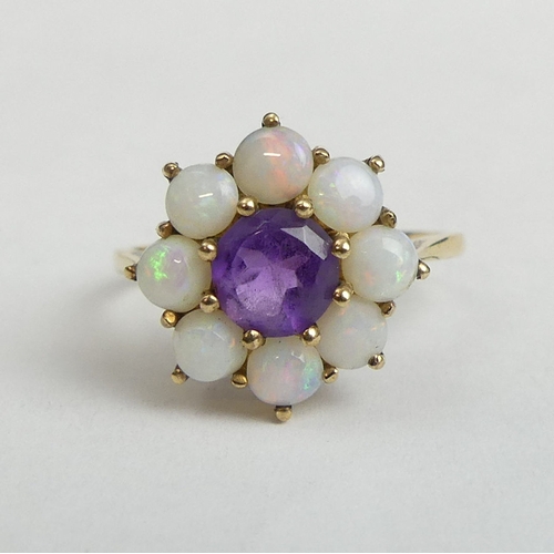 21 - 9 carat gold amethyst and opal cluster ring, 2.4 grams. Size N 1/2, 14.7 mm wide. UK Postage £12.