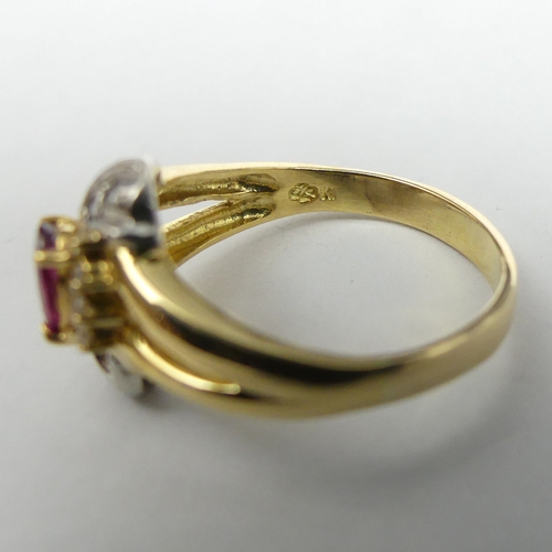 22 - 9 carat two colour gold ruby and diamond ring, 4.7 grams. Size P, 13.4 mm wide. UK Postage £12.