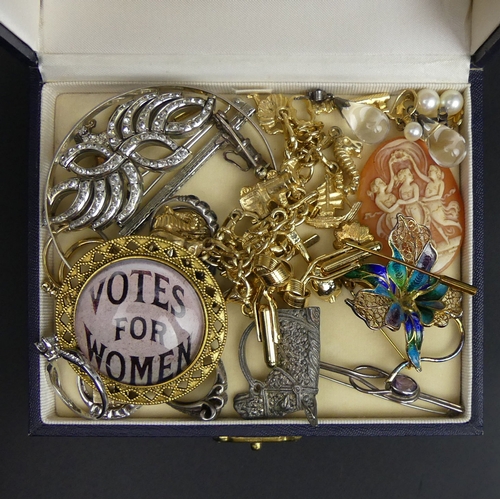 23 - A box of mixed jewellery, including silver rings, a horse brooch, suffragette brooch and a charm bra... 