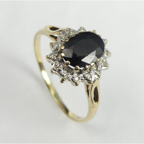 26 - 9 carat gold sapphire and diamond ring, 2.3 grams. Size R, 12.3 mm wide. UK Postage £12.