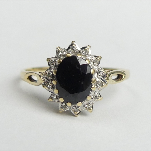 26 - 9 carat gold sapphire and diamond ring, 2.3 grams. Size R, 12.3 mm wide. UK Postage £12.
