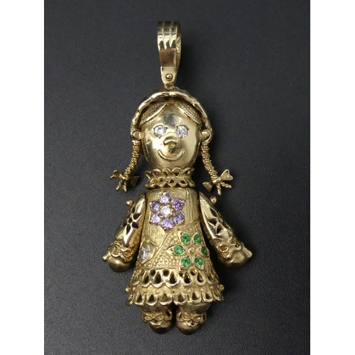 30e - 9ct gold stone set articulated doll design pendant, 15 grams. 62 mm long. UK Postage £12.