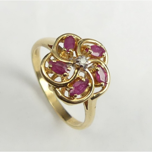 32 - 14 carat gold ruby and diamond ring, 3.2 grams. Size O, 12.9 mm wide. UK Postage £12.