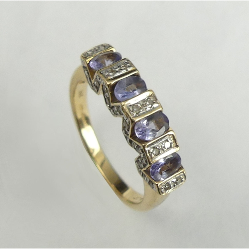 33 - 14 carat gold tanzanite and diamond ring, 3.4 grams. Size L, 4.5 mm wide. UK Postage £12.
