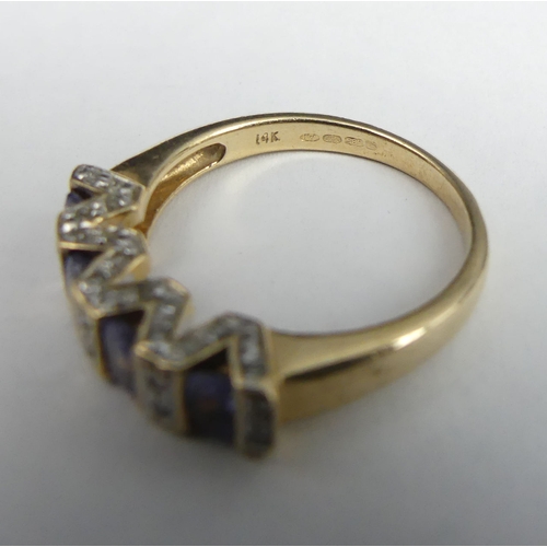 33 - 14 carat gold tanzanite and diamond ring, 3.4 grams. Size L, 4.5 mm wide. UK Postage £12.