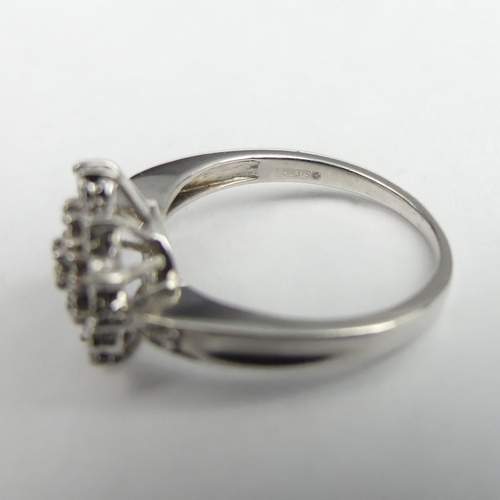 36 - 9 carat white gold diamond cluster ring, 3.8 grams. Size O, 12.6 mm wide. UK Postage £12.