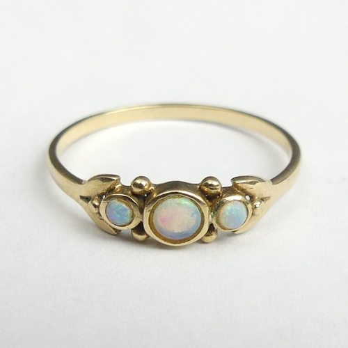 40c - 9ct gold opal three stone ring, 1.1 grams, Size P. UK Postage £12.