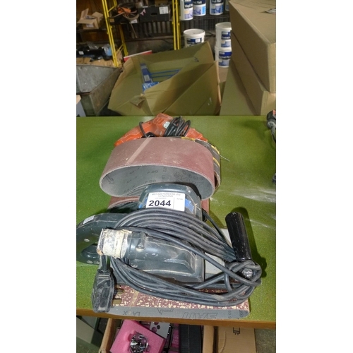 1 Elu 100mm belt sander with various spare sanding belts & 1 Black and