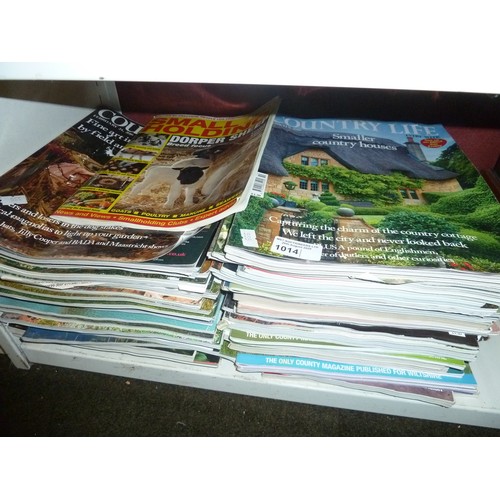 1014 - A quantity of vintage Tiger, Roy of the Rovers and other Comics and a quantity of country life magaz... 
