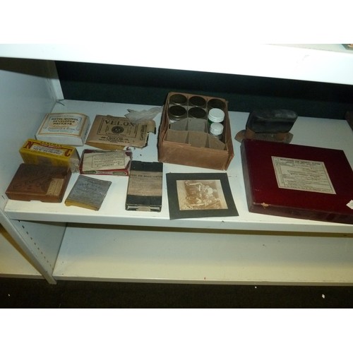 1031 - A quantity of miscellaneous Victorian and vintage Photographic items and equipment (4  shelves)
