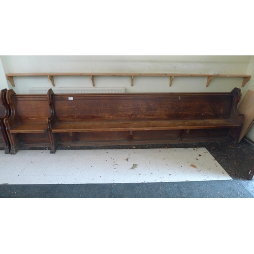 355 - A stained pine ecclesiastical pew, approximately 369cm wide, complete with a front panel section