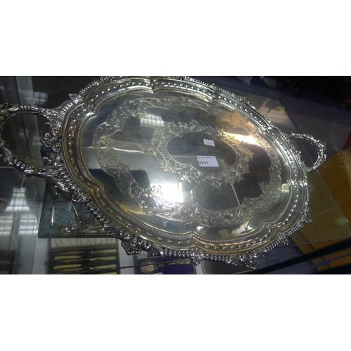 3151 - (H1) a large oval engraved silver tea tray with two handles approximately 59 cm long weighing approx... 