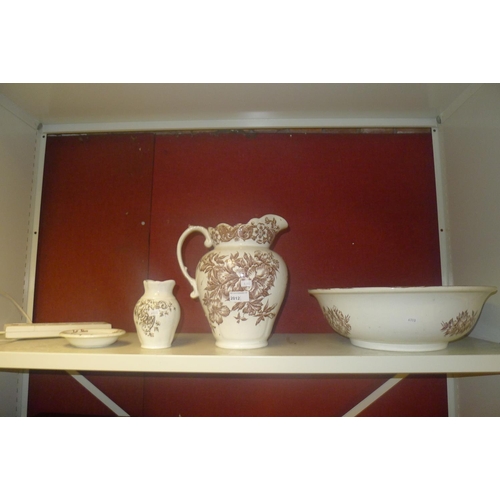 2012 - A brown and white floral patterned Victorian toilet set