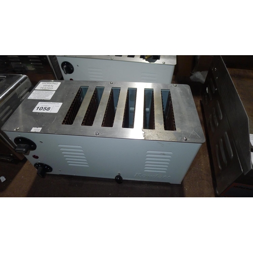 A commercial stainless steel Rowlett 6 slice toaster working when