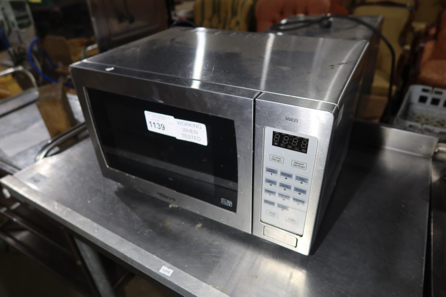 A stainless steel microwave oven by Hitachi type MSE23 trade