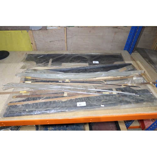 47 - A quantity of various New Old Stock (NOS) trims to fit a vintage DAF car
