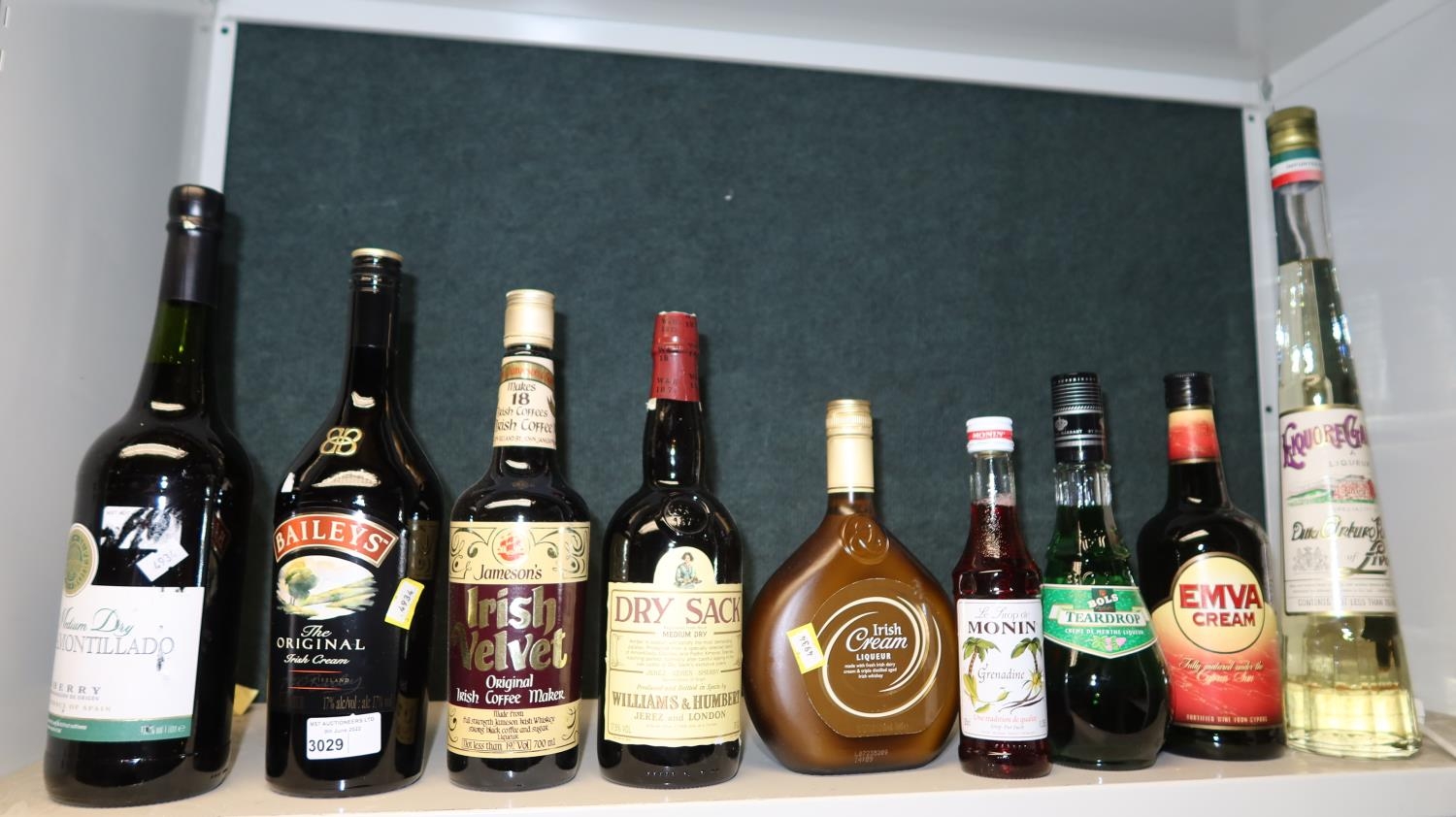 9-bottles-of-miscellaneous-liqueurs-one-shelf