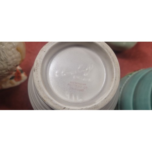 A collection of decorative jugs and vases including 3 jugs by Clarice