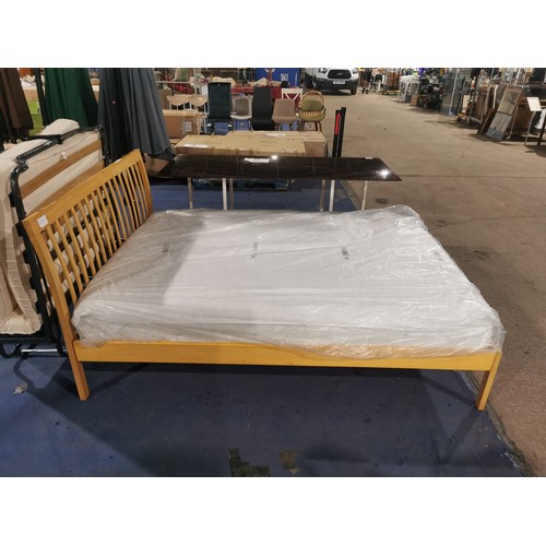 173b - A 4ft 6in wooden framed bed, the mattress is included