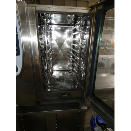 1174 - A commercial stainless steel single door 10 grid Combi oven by Rational type self cooking centre, wi... 