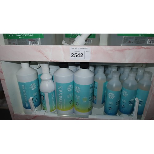 2542 - A shop display stand with a quantity of various nail salon related items including disinfectant, eye... 