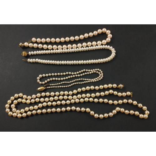 24B - A collection of FOUR QUALITY STRINGS OF PEARLS to include a 750 stamped yellow gold clasp string of ... 