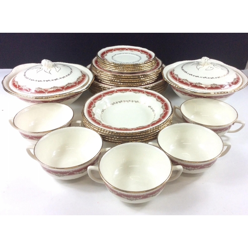 241 - A vintage dinner service by RIDGWAY (the pattern matches the Portland Pottery set with the exception... 