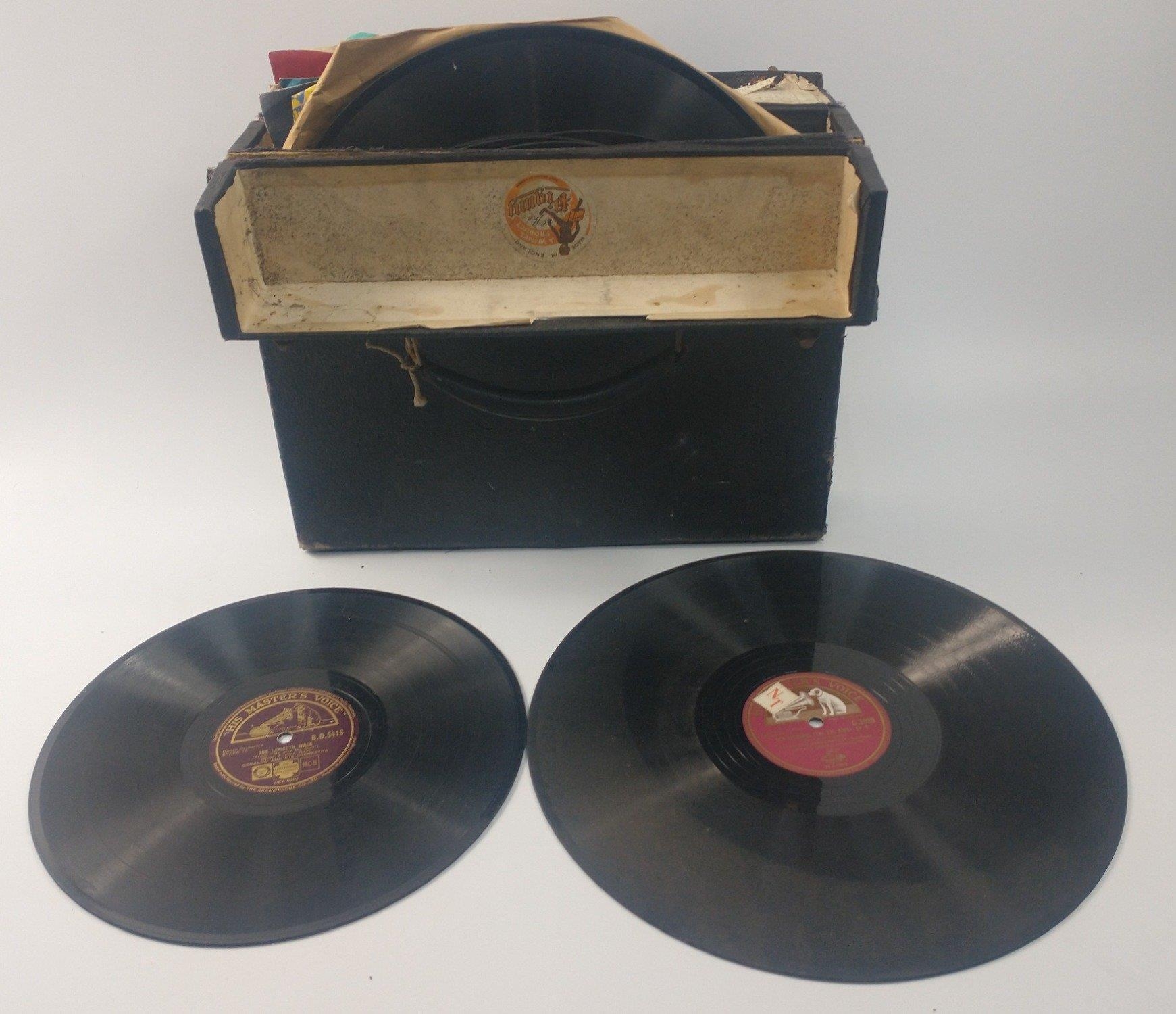 A vintage record carry case filled with vintage 78s including such