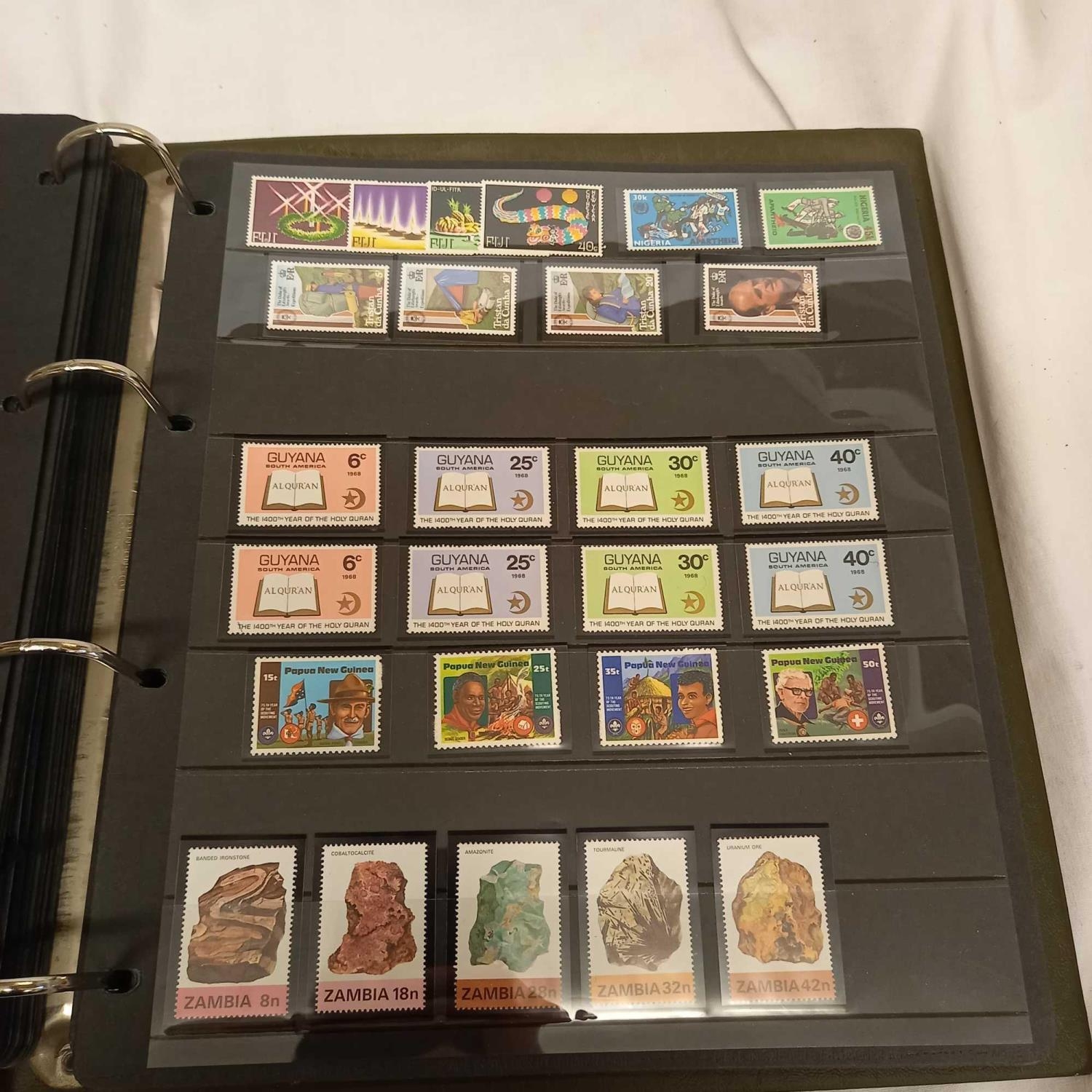 ALBUM OF LOOSE LEAF STAMPS MINT & USED MOSTLY COMMON WEALTH DISPLAYED