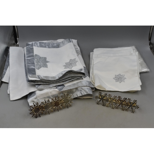 A Selection of Tablecloths, Table Placemats, Napkins and Napkin Rings.