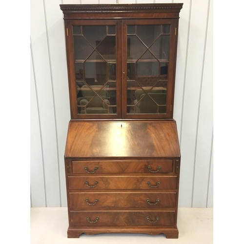 53 - A Mahogany, Edwardian Bureau Bookcase. Glazed bookcase with two internal shelves, over a 4-drawered ... 
