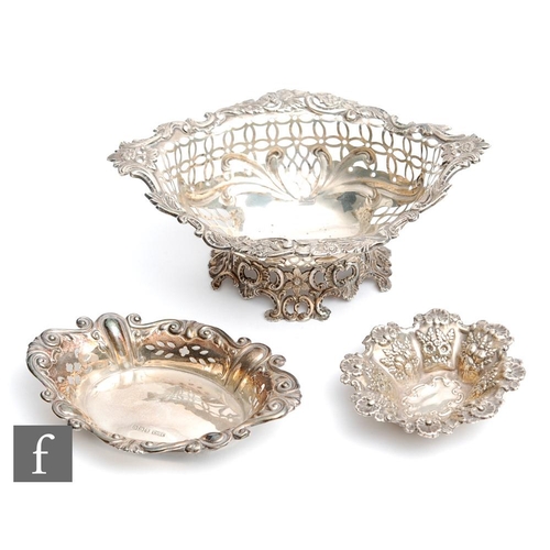 23 - Three late 19th to early 20th Century bon bon dishes with pierced and embossed foliate decoration, t... 