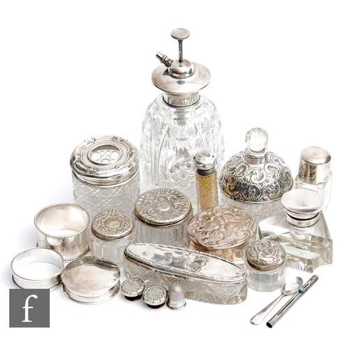 25 - A small parcel lot of assorted white metal, hallmarked and sterling silver topped scent bottles, rou... 