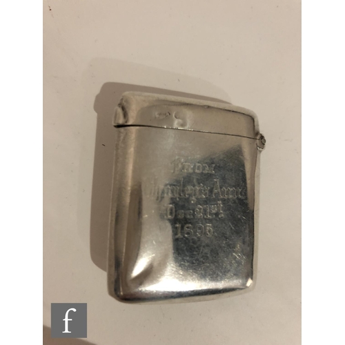 21 - A Victorian hallmarked silver rectangular vesta case with embossed portrait of Charley's Aunt to fro... 