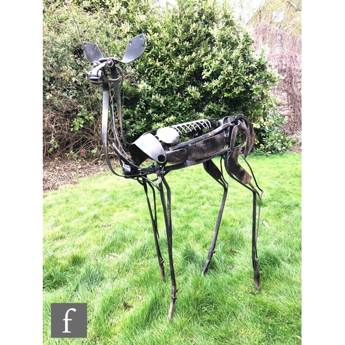 1223 - A contemporary life size study of a standing deer, constructed from various metal hand tools and gar... 