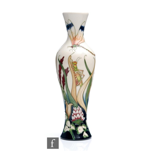 17 - A Moorcroft Pottery vase of slender form decorated in the Grasshopper pattern designed by Phil Richa... 