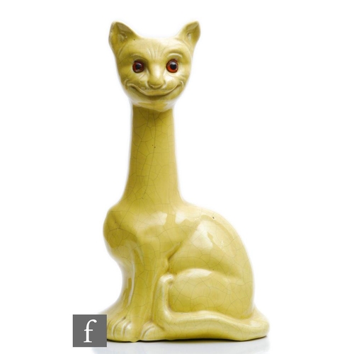 22 - A large early 20th Century novelty vase modelled as a cat with an elongated neck and glazed in yello... 