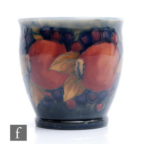 28 - A small Moorcroft fern or plant pot decorated in the Pomegranate pattern with a band of open and who... 