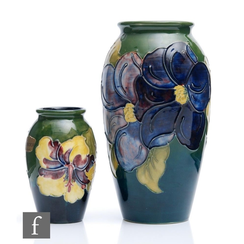 36 - Two Moorcroft vases, both of swollen form, the first decorated in the Clematis pattern, the second i... 