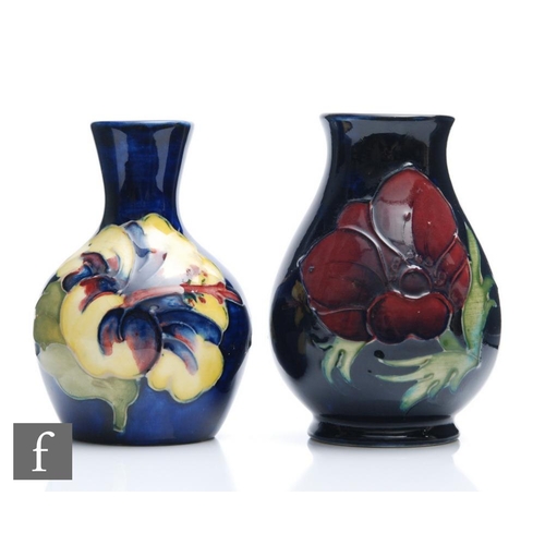 38 - Two Moorcroft vases, the first decorated in the Anemone pattern (marked as a second), the second in ... 