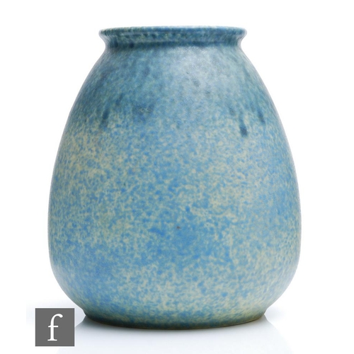 57 - A large Ruskin Pottery vase of swollen form decorated in a mottled blue over a pale yellow ground, i... 